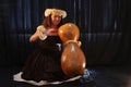 Smiling female Hawaiian girl dancing and singing with musical instruments like the ukulele Royalty Free Stock Photo