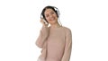 Smiling female with headphones walking and dancing to the music Royalty Free Stock Photo