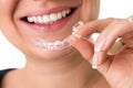 Smiling female holding invisible teeth braces Royalty Free Stock Photo