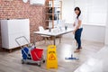 Smiling Female Janitor Cleaning Floor Royalty Free Stock Photo