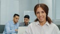 Smiling female leader manager coach speaker looking at camera. Friendly businesswoman greeting or welcoming new worker Royalty Free Stock Photo