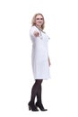 smiling female medic pointing at you. isolated on a white