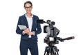 smiling female newscaster with digital tablet standing in front of camera,