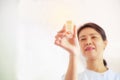 Smiling female nurse holding pill cup in her hands for patients. Professional, Specialist, Nurse, Doctor in white uniform concept Royalty Free Stock Photo