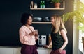 Smiling female office coworkers talking together during a break Royalty Free Stock Photo