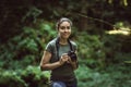 Photographer taking pictures in the forest Royalty Free Stock Photo