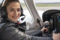 Smiling Female Pilot in the Cockpit of an Airplane Royalty Free Stock Photo