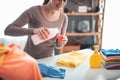 Smiling female preparing garments for laundry Royalty Free Stock Photo