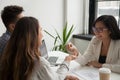 Female real estate agent giving keys to excited couple Royalty Free Stock Photo