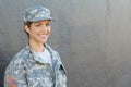 Smiling female soldier standing with copy space