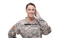 Smiling female soldier using mobile phone