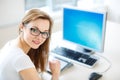 Smiling female student/ businesswoman using her tablet computer