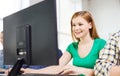 Smiling female student in computer class Royalty Free Stock Photo