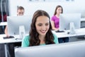 Smiling female student in computer class Royalty Free Stock Photo