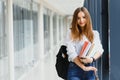 Smiling female student enhancing her future by attending regular lectures