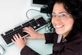 Smiling female working on computer