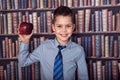 Smiling first-grader boy with apple Royalty Free Stock Photo