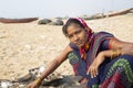 A smiling Fisher women working in chandrabhaga,Konark, Odisha, India.