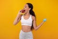 Smiling Fit Lady Holding Blue Dumbbell Eating Apple Royalty Free Stock Photo