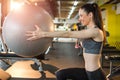 Smiling fit sportswoman exercising with pilates ball in gym Royalty Free Stock Photo