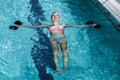 Smiling fit woman doing aqua aerobics Royalty Free Stock Photo