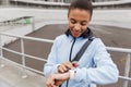 Smiling fit young african sportswoman carrying sportsbag Royalty Free Stock Photo