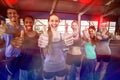 Smiling fitness class posing together with thumbs up Royalty Free Stock Photo