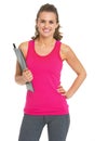 Smiling fitness trainer with clipboard Royalty Free Stock Photo