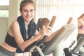 Smiling Fitness woman is running on treadmill with friends Royalty Free Stock Photo