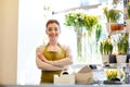 Smiling florist woman at flower shop cashbox Royalty Free Stock Photo