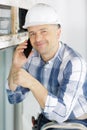 smiling foreman talking on cell phone Royalty Free Stock Photo