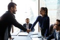 Smiling friendly businesswoman hr manager greeting candidate at meeting