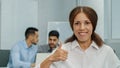 Smiling Friendly businesswoman looking at camera showing like thumbs up. Enthusiastic happy successful female leader Royalty Free Stock Photo