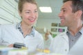smiling friendly efficient male and female pharmacists Royalty Free Stock Photo