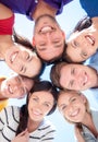 Smiling friends in circle on summer beach Royalty Free Stock Photo