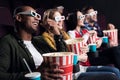 smiling friends in 3d glasses with popcorn and soda watching movie