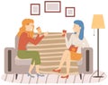 Smiling friends drinking tea and talking at home Happy women laughing and gossiping sit on couch Royalty Free Stock Photo