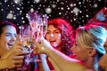 Smiling friends with glasses of champagne in club Royalty Free Stock Photo