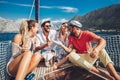 Smiling friends with glasses of champagne on yacht Royalty Free Stock Photo