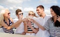 Smiling friends with glasses of champagne on yacht Royalty Free Stock Photo