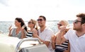 Smiling friends with glasses of champagne on yacht Royalty Free Stock Photo