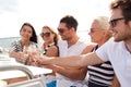 Smiling friends with glasses of champagne on yacht Royalty Free Stock Photo