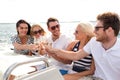 Smiling friends with glasses of champagne on yacht Royalty Free Stock Photo