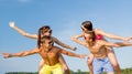 Smiling friends having fun on summer beach Royalty Free Stock Photo