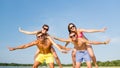 Smiling friends having fun on summer beach Royalty Free Stock Photo