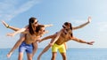 Smiling friends having fun on summer beach Royalty Free Stock Photo