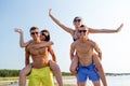 Smiling friends having fun on summer beach Royalty Free Stock Photo