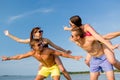 Smiling friends having fun on summer beach Royalty Free Stock Photo