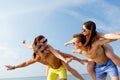 Smiling friends having fun on summer beach Royalty Free Stock Photo