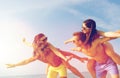 Smiling friends having fun on summer beach Royalty Free Stock Photo